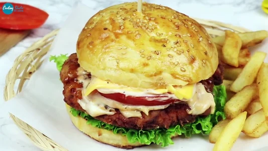Beef patty, smoked applewood cheddar, smoked streaky bacon, jalapeno relish, lettuce, pickled red onions, Naga and Chipotle